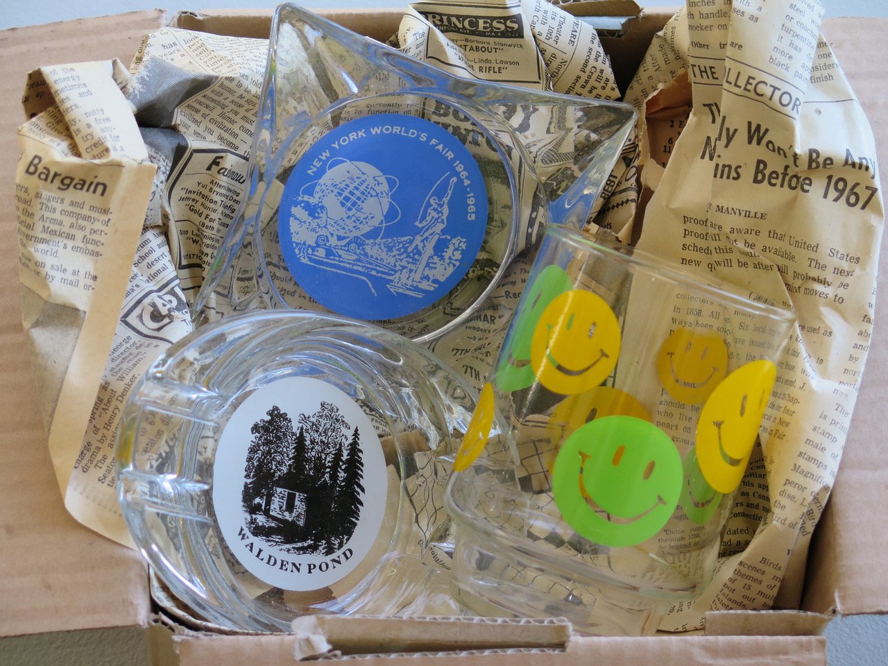 KleinAmericanGlassware American Glassware, 2010 Walden Pond Ashtray (two color screenprint on glass ashtray, edition #1/6), found glass screenprinted ashtray and drinking glass, vintage newspaper, cardboard box 15 x 6 1/2 x 12 inches